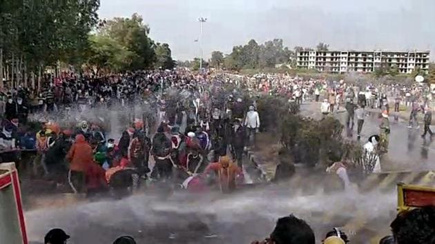 Police use water cannon and tear-gas shells in Karnal to disperse farmers from Punjab heading towards Delhi on Thursday.(ANI)