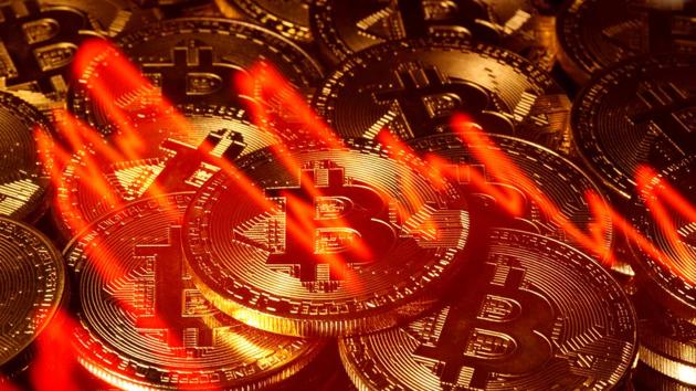 Illumination of the stock graph is seen on the representations of virtual currency Bitcoin in this picture illustration(Reuters File Photo) Illumination of the stock graph is seen on the representations of virtual currency Bitcoin in this picture illustration(Reuters File Photo)