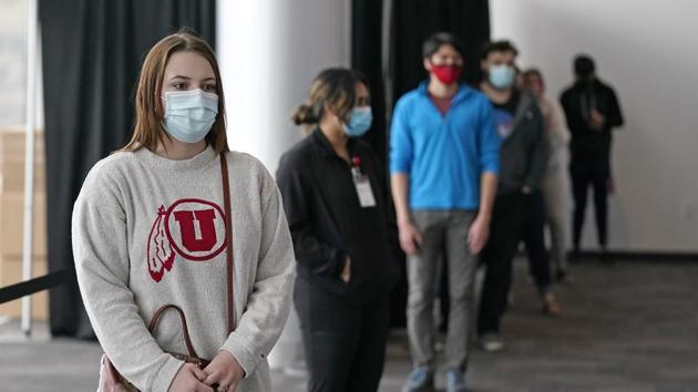 University of Utah students waits in line before taking a rapid Covid-19 test at the University of Utah student testing site in Salt Lake City.(AP) University of Utah students waits in line before taking a rapid Covid-19 test at the University of Utah student testing site in Salt Lake City.(AP)