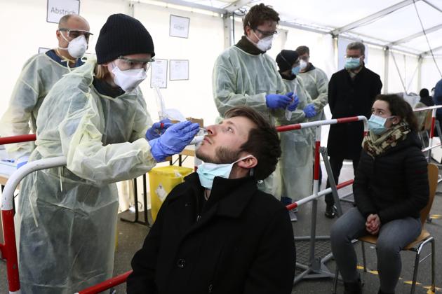 Medical employees demonstrate testing at a coronavirus test center for public service employees in Munich, Germany. Germany has hit another grim milestone in the coronavirus pandemic ticking above 1 million confirmed coronavirus cases. (AP) Medical employees demonstrate testing at a coronavirus test center for public service employees in Munich, Germany. Germany has hit another grim milestone in the coronavirus pandemic ticking above 1 million confirmed coronavirus cases. (AP)