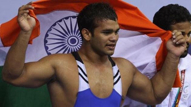 Narsingh Pancham Yadav of India celebrates after winning gold in the men's 74KG Wrestling at IG Sports Complex.(Getty Images)