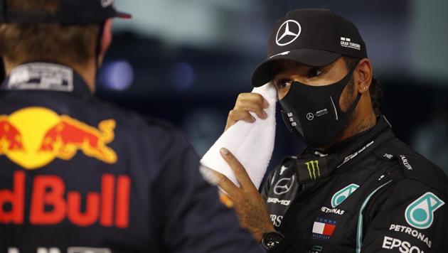 Mercedes' Lewis Hamilton wearing a protective face mask after qualifying in pole position.(Pool via REUTERS)