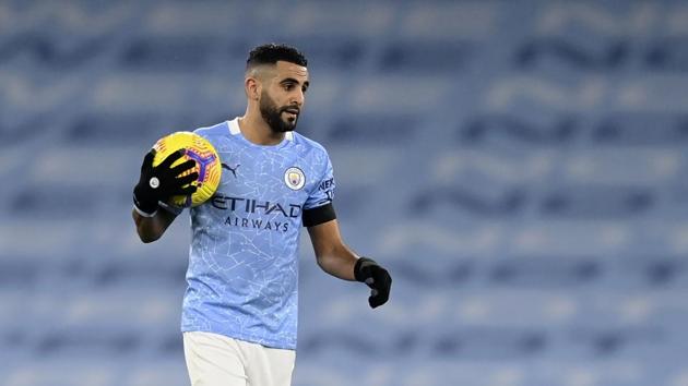 Manchester City's Riyad Mahrez holds the ball at the end of the English Premier League soccer match between Manchester City and Burnley at the Etihad stadium in Manchester.(AP)
