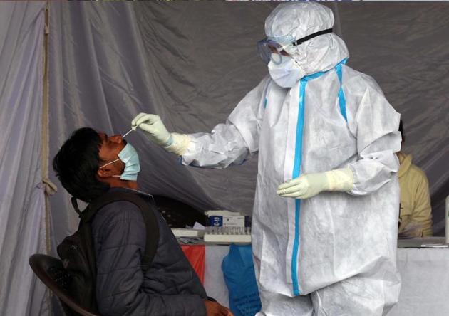 A passenger getting sampled for a Covid test at the ISBT in Sector 17, Chandigarh, on Friday.(Keshav Singh/HT) A passenger getting sampled for a Covid test at the ISBT in Sector 17, Chandigarh, on Friday.(Keshav Singh/HT)
