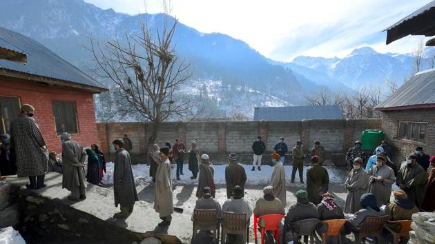 Ganderbal: People wait to cast their votes at a polling booth during the first phase of the District Development Council (DDC) elections in central Kashmir. (PTI) Ganderbal: People wait to cast their votes at a polling booth during the first phase of the District Development Council (DDC) elections in central Kashmir. (PTI)