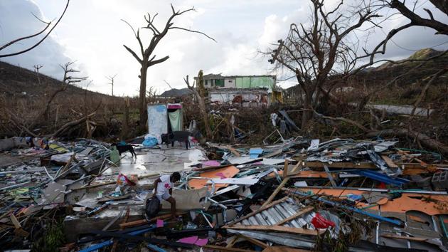 A girl walks through the rubble of a house after the landfall of Hurricane Iota in Providencia, Colombia on November 23.  (Nathalia Angarita / REUTERS) 