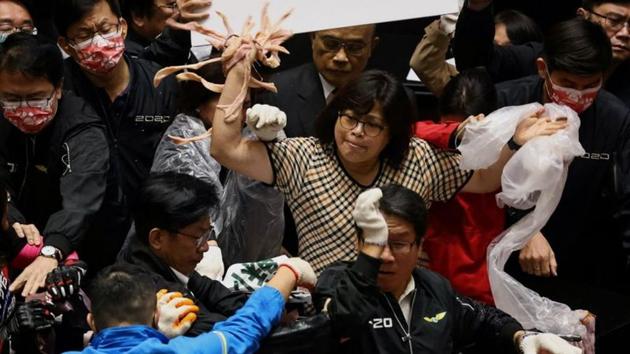 Taiwan lawmakers throw pork intestines at each other during a scuffle in the parliament in Taipei, Taiwan on November 27. (Ann Wang / REUTERS) 