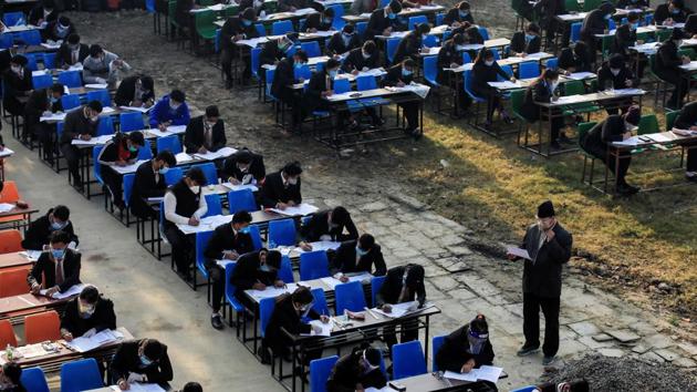 Students wearing face masks appear for their grade 12 exams amid the coronavirus outbreak in Kathmandu, Nepal on November 24. (Navesh Chitrakar / REUTERS) 