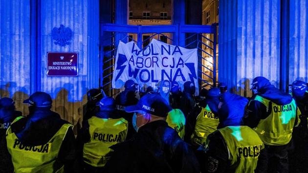 Police try to remove demonstrators taking part in a pro-choice protest outside Polish Ministry of Education in Warsaw, Poland on November 23. A wave of protesters are demonstrating across Poland since October 22 against the country’s near-total ban on abortion.  (Wojtek Radwanski / AFP) 