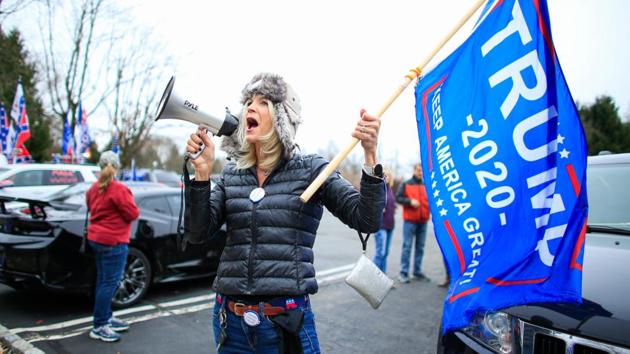 A woman shouts slogans as US President Donald Trump’s supporters gather during a car rally “Stop the Steal” in Long Valley, New Jersey, US on November 22. (Kena Betancur / AFP) 