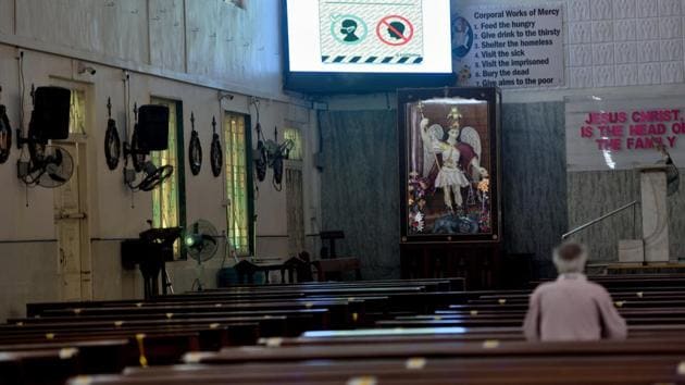 Christian devote offer prayer at Mahim Church, after places of worships in Maharashtra state reopened following more than eight months of shutdown due to the Covid-19 coronavirus pandemic in Mumbai.(Satish Bate/HT Photo) Christian devote offer prayer at Mahim Church, after places of worships in Maharashtra state reopened following more than eight months of shutdown due to the Covid-19 coronavirus pandemic in Mumbai.(Satish Bate/HT Photo)