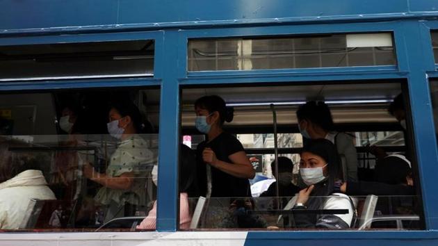Passengers wearing face masks following the coronavirus disease (Covid-19) outbreak ride on a tram in Hong Kong, China.(Reuters) Passengers wearing face masks following the coronavirus disease (Covid-19) outbreak ride on a tram in Hong Kong, China.(Reuters)