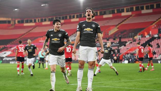 Manchester United's Edinson Cavani celebrates scoring their second goal.(Pool via REUTERS)