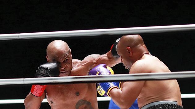 In a photo provided by Triller, Mike Tyson throws a punch during the third round against Roy Jones Jr. in an exhibition boxing bout Saturday, Nov. 28, 2020, in Los Angeles. The bout was unofficially ruled a draw by the WBC judges at ringside. Tyson and Jones fought eight two-minute rounds, and both emerged smiling and apparently healthy from a highly unusual event. (Joe Scarnici/Triller via AP)(AP) In a photo provided by Triller, Mike Tyson throws a punch during the third round against Roy Jones Jr. in an exhibition boxing bout Saturday, Nov. 28, 2020, in Los Angeles. The bout was unofficially ruled a draw by the WBC judges at ringside. Tyson and Jones fought eight two-minute rounds, and both emerged smiling and apparently healthy from a highly unusual event. (Joe Scarnici/Triller via AP)(AP)