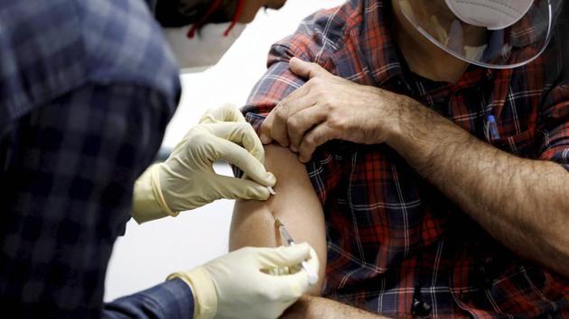 A medic administers Covaxin to a health worker during its trials, at the Gujarat Medical Education & Research Society in Ahmedabad, on November 26.(File photo)