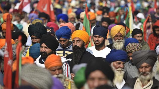 Farmers offer prayers on the occasion of Guru Nanak Dev Jayanti at Singhu border in New Delhi on November 30. “We have definitely come here from Punjab but we will celebrate Guruparva the same way we do every year. In Ardas, we pray that our Guru Nanak ji gives good sense to the government so that the “black laws” being imposed on us are scrapped,” Bharatiya Kisan Union (Doaba) president Manjeet Singh told ANI. (Biplov Bhuyan / HT Photo)