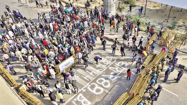 Bharatiya Kisan Union (BKU) members protest after police imposed section 144 at Ghazipur border, during their 'Delhi Chalo' march against the new farm laws, in New Delhi. (PTI) Bharatiya Kisan Union (BKU) members protest after police imposed section 144 at Ghazipur border, during their 'Delhi Chalo' march against the new farm laws, in New Delhi. (PTI)