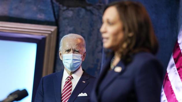 President-elect Joe Biden listens as Vice President-elect Kamala Harris, speaks about economic recovery at The Queen theater, Monday, Nov. 16, 2020, in Wilmington, Del. (AP) President-elect Joe Biden listens as Vice President-elect Kamala Harris, speaks about economic recovery at The Queen theater, Monday, Nov. 16, 2020, in Wilmington, Del. (AP)