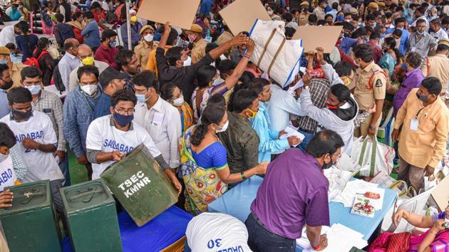 Polling officers collect election materials ahead of the Greater Hyderabad Municipal Corporation (GHMC) elections, in Hyderabad, on Nov 30, 2020.(PTI)