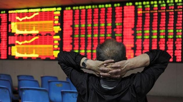 An investor places his hands on the back of his head in front of an electronic board showing stock information at a brokerage house in Hefei, Anhui province, China.(Reuters File Photo) An investor places his hands on the back of his head in front of an electronic board showing stock information at a brokerage house in Hefei, Anhui province, China.(Reuters File Photo)