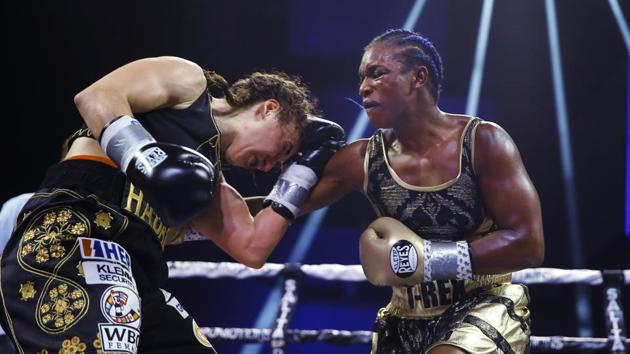 Claressa Shields, right, punches Ivana Habazin during the seventh round of a women's 154-pound title boxing bout in Atlantic City, N.J. Shields is already dominating the boxing world with two Olympic gold medals and professional title belts in three weight classes. Her next world to conquer is mixed martial arts.(AP) Claressa Shields, right, punches Ivana Habazin during the seventh round of a women's 154-pound title boxing bout in Atlantic City, N.J. Shields is already dominating the boxing world with two Olympic gold medals and professional title belts in three weight classes. Her next world to conquer is mixed martial arts.(AP)