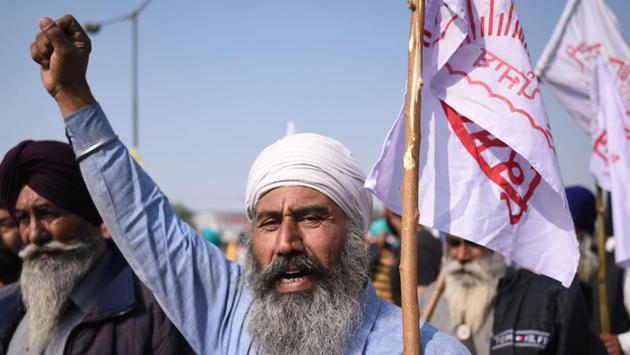 A farmer raises slogans during the ongoing protest at Singhu border in New Delhi on November 30. The next round of talks was originally scheduled for December 3 but were advanced after home minister Amit Shah and agriculture minister Narendra Singh Tomar met twice in a span of 24 hours on November 30 to discuss the course of action. (Biplov Bhuyan / HT Photo)