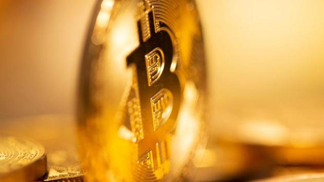 Bitcoin fell 5.6% against the dollar on Tuesday, after hitting a record high earlier in the day.(Reuters/ Representational photo) Bitcoin fell 5.6% against the dollar on Tuesday, after hitting a record high earlier in the day.(Reuters/ Representational photo)