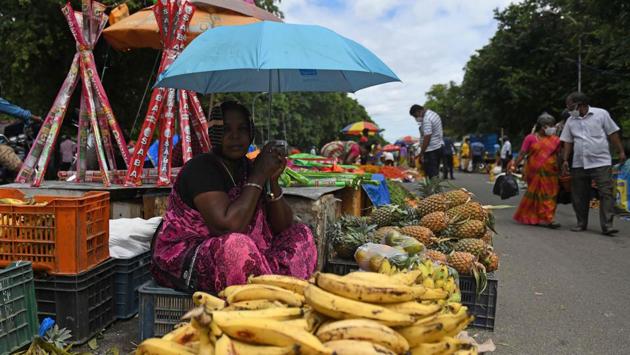 A vendor waits for customers at a weekly market in Chennai on November 27. India’s active caseload has further contracted to 4,35,603 over the previous 24 hours and their share in the total positive cases has shrunk to 4.60%, health ministry’s data showed. (Arun Sankar / AFP) A vendor waits for customers at a weekly market in Chennai on November 27. India’s active caseload has further contracted to 4,35,603 over the previous 24 hours and their share in the total positive cases has shrunk to 4.60%, health ministry’s data showed. (Arun Sankar / AFP)