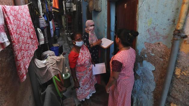 Health workers screen people for tuberculosis and leprosy in Dharavi, Mumbai on December 1. New infections due to Covid-19 have declined steadily since the first week of October. A total 12,78,727 cases were reported in November, a decrease from October’s 18,71,498, accounting for about 13.51% of the total instances of infection in the country so far, PTI reported citing government data. (Rafiq Maqbool / AP) Health workers screen people for tuberculosis and leprosy in Dharavi, Mumbai on December 1. New infections due to Covid-19 have declined steadily since the first week of October. A total 12,78,727 cases were reported in November, a decrease from October’s 18,71,498, accounting for about 13.51% of the total instances of infection in the country so far, PTI reported citing government data. (Rafiq Maqbool / AP)