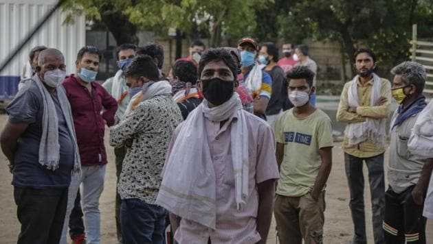 Relatives of a man who died of Covidd-19 related complications, wait to cremate his body at Vadaj Cemetery in Ahmedabad, India, Sunday, Nov. 29, 2020. India has more than 9 million cases of coronavirus, second behind the United States.(AP)