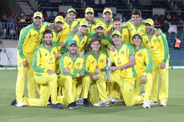 The Australian team pose for a photo with their trophy after winning the one day series against India 2-1 following the final match at Manuka Oval, Canberra, Australia, Tuesday, Dec 2, 2020. (AP Photo/Mark Baker) (AP)