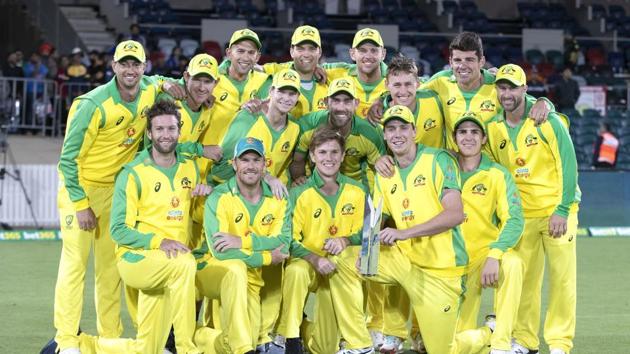 The Australian team pose for a photo with their trophy after winning the one day series against India 2-1 following the final match at Manuka Oval, Canberra, Australia, Tuesday, Dec 2, 2020. (AP Photo/Mark Baker) (AP)