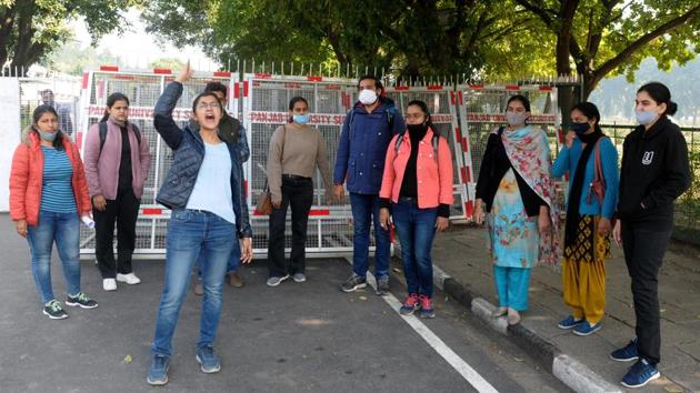 Students raise slogans outside V-C office at Panjab University in Chandigarh on Tuesday. (Ravi Kumar/HT) Students raise slogans outside V-C office at Panjab University in Chandigarh on Tuesday. (Ravi Kumar/HT)