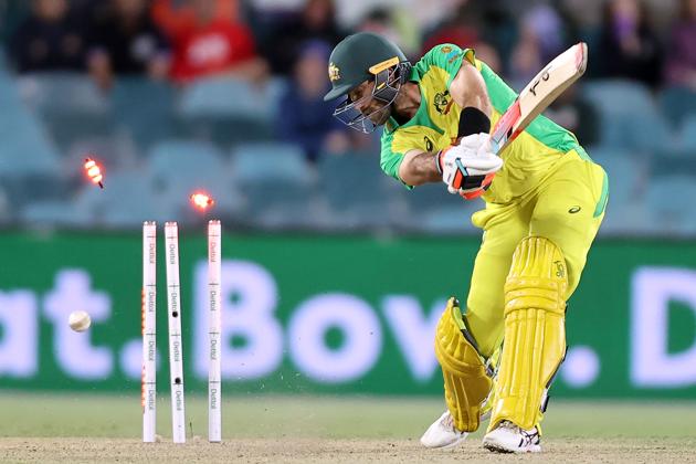 Australia's batsman Glenn Maxwell is clean bowled by India's paceman Jasprit Bumrah during the third one-day international cricket match between Australia and India at Manuka Oval in Canberra on December 2, 2020. (Photo by DAVID GRAY / AFP) / / IMAGE RESTRICTED TO EDITORIAL USE - STRICTLY NO COMMERCIAL USE (AFP)