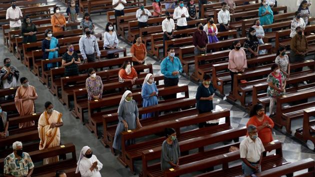Devotees wearing masks and keeping physical distance, attend Sunday mass at a church in Mumbai on November 29. Despite official claims and the relaxations, there remains a need for caution. Dr Siddarth Paliwal, a city-based doctor, told HT, “Cases might have gone down because testing has also gone down. The positivity rate may have gone down due to increased use of rapid antigen kits, which have lower positivity rate in comparison to RT-PCR kits.” (Francis Mascarenhas / REUTERS)