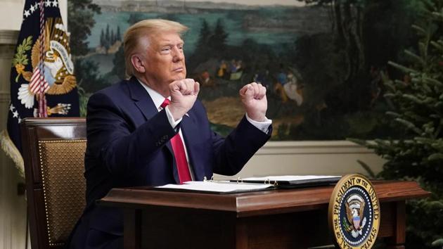 President Donald Trump gestures as he participates in a video teleconference call with members of the military on Thanksgiving, Thursday, Nov. 26, 2020, at the White House in Washington. (AP Photo/Patrick Semansky) President Donald Trump gestures as he participates in a video teleconference call with members of the military on Thanksgiving, Thursday, Nov. 26, 2020, at the White House in Washington. (AP Photo/Patrick Semansky)