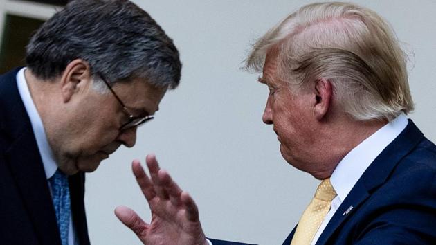 US Attorney General William Barr (left) and US President Donald Trump at the White House in Washington, DC last year.(AFP/ file)
