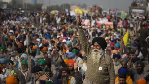 An elderly farmers shouts slogans as others listen to a speaker as they block a major highway during a protest at the Delhi-Haryana state border, India, Tuesday, Dec. 1, 2020.(AP) An elderly farmers shouts slogans as others listen to a speaker as they block a major highway during a protest at the Delhi-Haryana state border, India, Tuesday, Dec. 1, 2020.(AP)