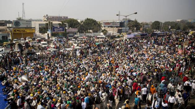 Farmers listen to a speaker as they block a major highway during a protest at the Delhi-Haryana border.(AP Photo) Farmers listen to a speaker as they block a major highway during a protest at the Delhi-Haryana border.(AP Photo)