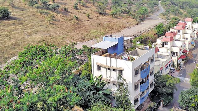 MIT claims the road constructed on the said hill slope of Vetal tekdi and survey number 123 belongs to the institution. (HT PHOTO) MIT claims the road constructed on the said hill slope of Vetal tekdi and survey number 123 belongs to the institution. (HT PHOTO)