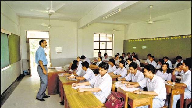 students and teacher in a class room(Agencies)