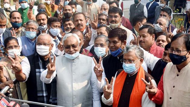 Former deputy CM Sushil Kumar Modi flashes victory sign with Bihar chief minister Nitish Kumar, deputy CM Tarkishor Prasad and others after filing nomination for Rajya Sabha as the NDA candidate.(ANI Photo)