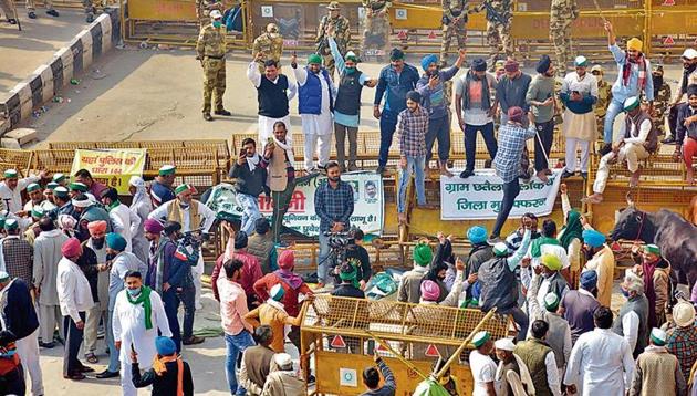 Farmers at a protest against the new farm laws New Delhi-UP border, Wednesday.(Photo: Sakib Ali/HT photo)