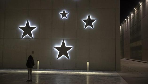 A child look at Christmas decoration at the Stavros Niarchos Foundation Cultural Center, in Athens.(AP) A child look at Christmas decoration at the Stavros Niarchos Foundation Cultural Center, in Athens.(AP)