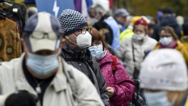 People wear face masks at the Hakaniemi Sunday market amid the coronavirus disease (Covid-19) outbreak in Helsinki, Finland.(Reuters)