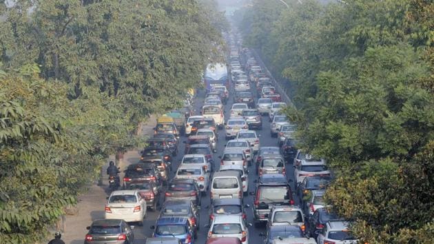 Commuters stuck in a heavy traffic congestion due to a road blockade by farmers in Noida on December 02. Vehicular traffic, especially in outer and east Delhi areas, has been impacted because of the closure of several border points connecting Delhi-Haryana and Delhi-Uttar Pradesh. The latest among these was a blockage on NH-9 near the UP Gate on December 3. The move has led to disruption of traffic from Ghaziabad to Delhi. (Sunil Ghosh / HT Photo)