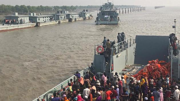 Rohingya refugees board a Bangladesh Navy ship to be transported to the island of Bhashan Char in Chittagong on December 4. The United Nations has voiced concern that refugees be allowed to make a “free and informed decision” about whether to relocate to the island in the Bay of Bengal. (AFP) Rohingya refugees board a Bangladesh Navy ship to be transported to the island of Bhashan Char in Chittagong on December 4. The United Nations has voiced concern that refugees be allowed to make a “free and informed decision” about whether to relocate to the island in the Bay of Bengal. (AFP)