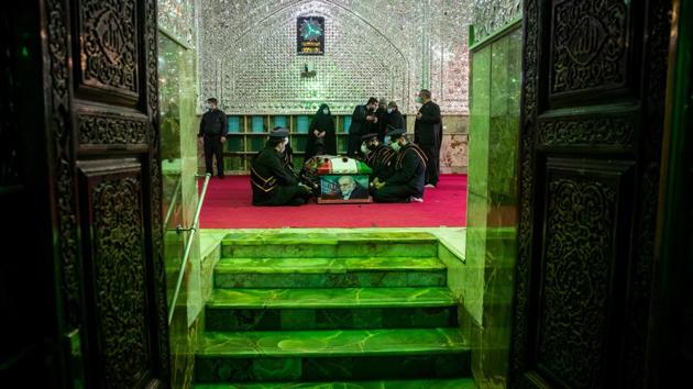 People mourn next to the coffin of Iranian nuclear scientist Mohsen Fakhrizadeh, during the burial ceremony at the shrine of Imamzadeh Saleh, in Tehran, Iran on November 30. (Hamed Malekpour / WANA via REUTERS ) People mourn next to the coffin of Iranian nuclear scientist Mohsen Fakhrizadeh, during the burial ceremony at the shrine of Imamzadeh Saleh, in Tehran, Iran on November 30. (Hamed Malekpour / WANA via REUTERS )