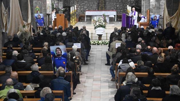 People attend the funeral ceremony of former French rugby international player Christophe Dominici at Saint-Louis church in Hyeres, France on December 4. According to the police, Dominici was found dead in a park near Paris on November 24. He was 48. (Christophe Simon / AFP) People attend the funeral ceremony of former French rugby international player Christophe Dominici at Saint-Louis church in Hyeres, France on December 4. According to the police, Dominici was found dead in a park near Paris on November 24. He was 48. (Christophe Simon / AFP)