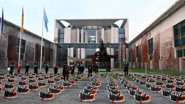 Environmental activists of Campact group stage a protest with some 200 oversized cardboard bees installed in front of the Chancellery in Berlin, Germany on December 2. (Tobias Schwarz / AFP) Environmental activists of Campact group stage a protest with some 200 oversized cardboard bees installed in front of the Chancellery in Berlin, Germany on December 2. (Tobias Schwarz / AFP)